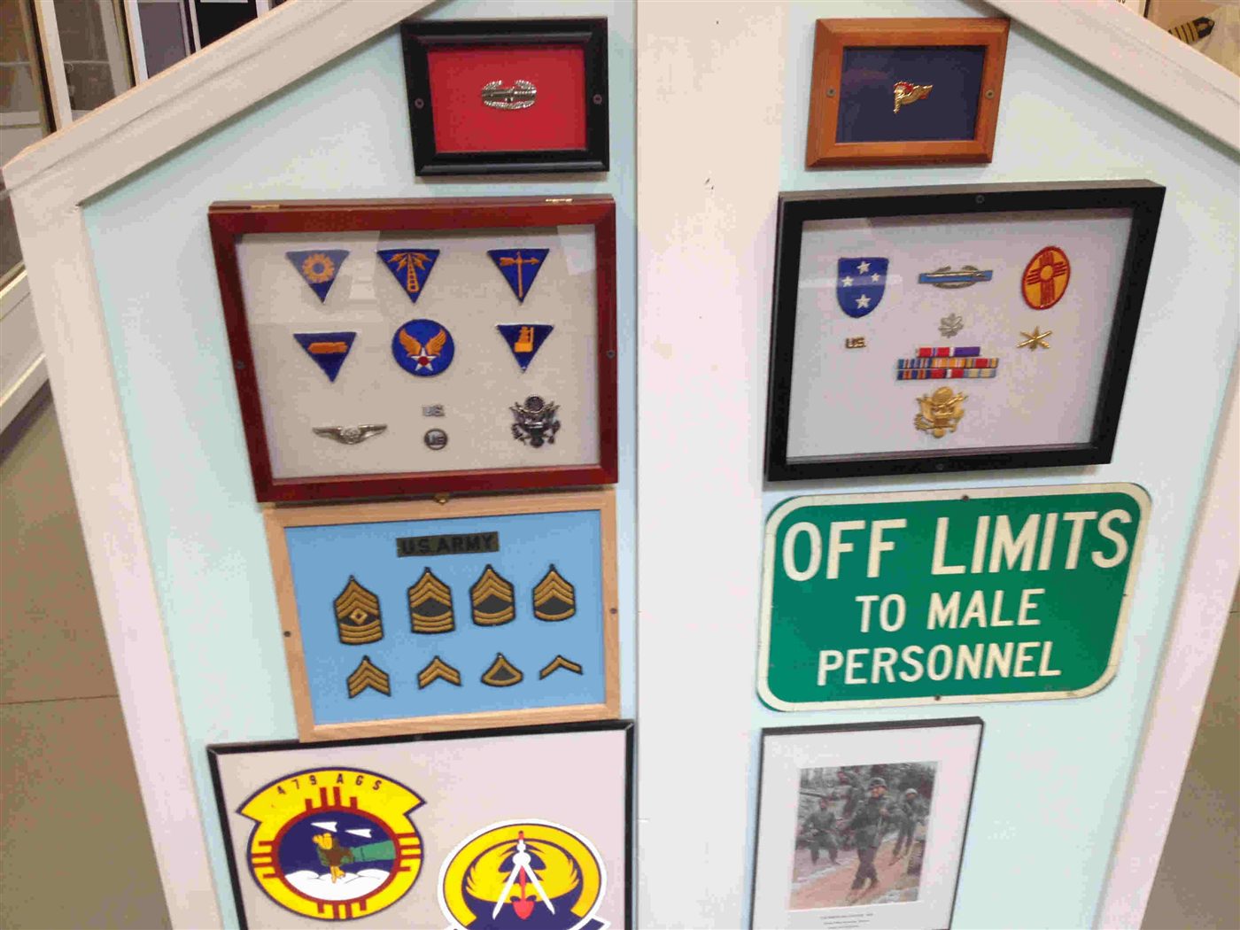 Framed collection of military unit patches