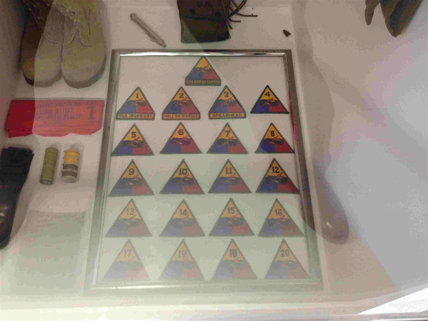 Framed collection of military unit patches